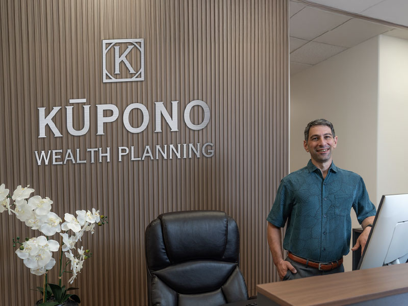 Brandon Wallis, of Kūpono Wealth Planning at Kūpono front desk 
