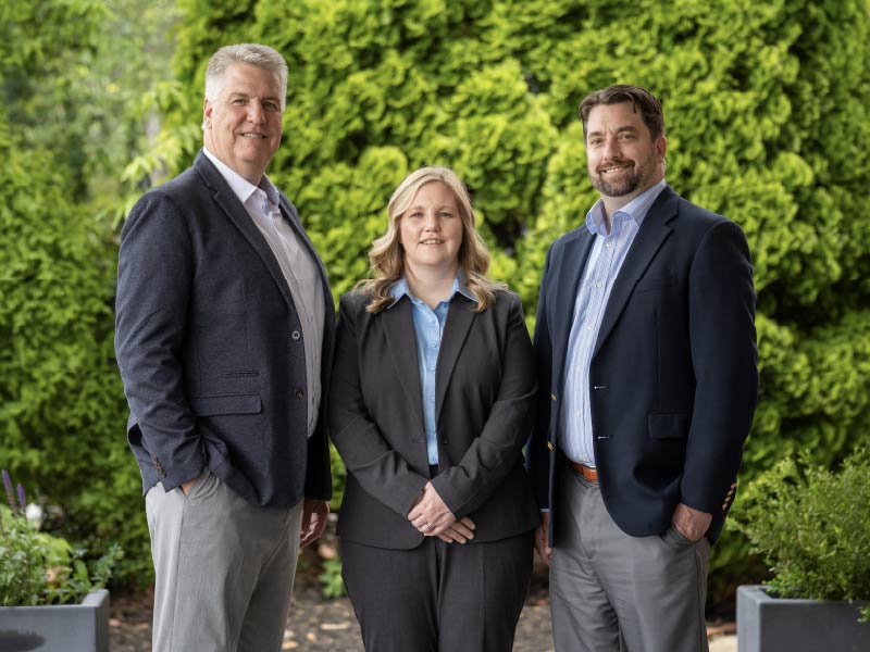 McCormick Private Wealth financial advisors Wayne McCormick (left), Michelle Lauder, and Bo Denniston
