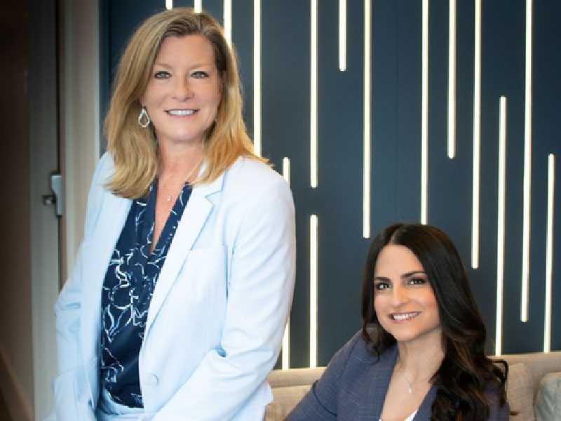 Sunny Day Financial advisor and owner Dawn Parks (left) and Karen Umpierre (right)