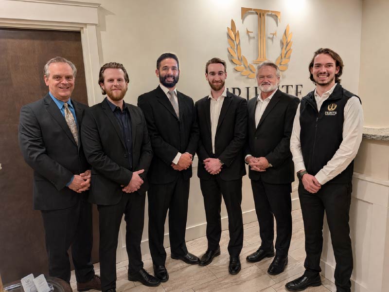 Tribute Financial advisors with Kevin Daniels (left), president and chief executive officer