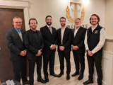 Tribute Financial advisors with Kevin Daniels (left), president and chief executive officer