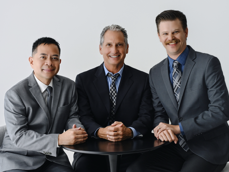 Williams Tax & Financial Services advisors Steve Williams (center), Jobel Rentino (left), Kirk Hunter (right)