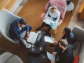group of diverse business people working in office cafeteria