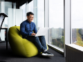 man working in office using laptop