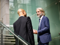 men talking on stairs