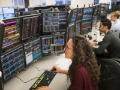 Traders analyzing computer data