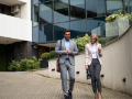 Business people walking out of office