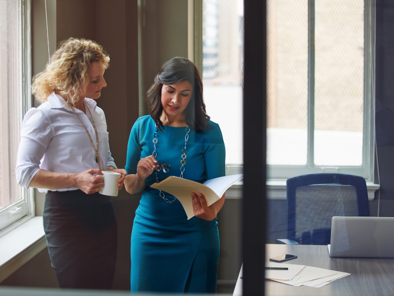 Two team members looking at paperwork