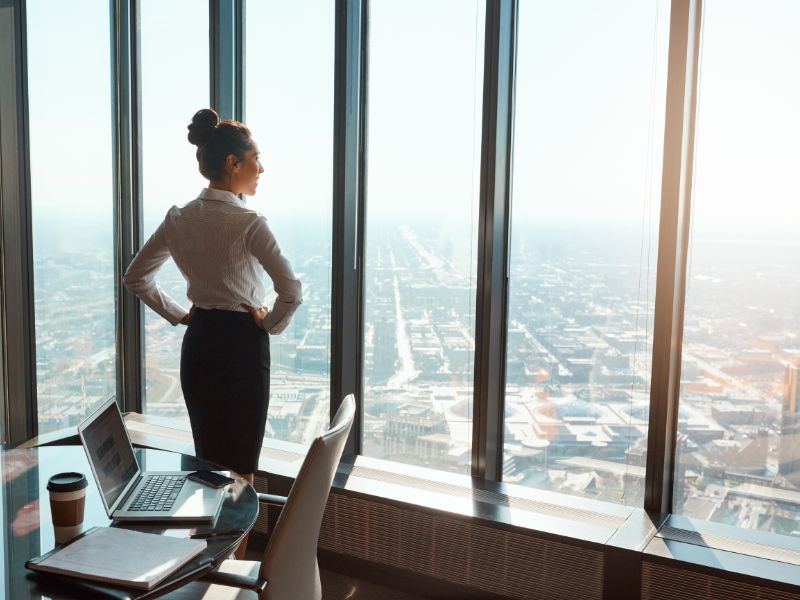 Businesswoman standing with her hands on her hips in the office