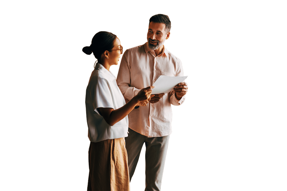 two financial advisors looking at information on a piece of paper