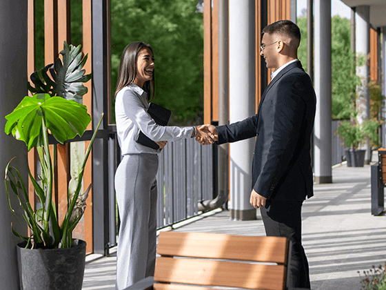 man and woman shaking hands