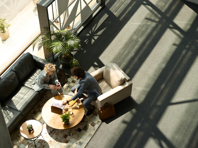 two people talking in lobby