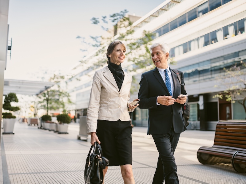 Capital Partner institutional financial advisors walking outside.