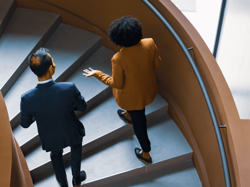 financial advisors climbing stairs forward toward greater opportunity