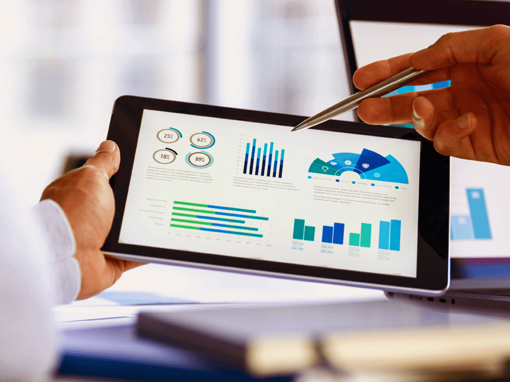 Financial investor looking at different investment charts on iPad