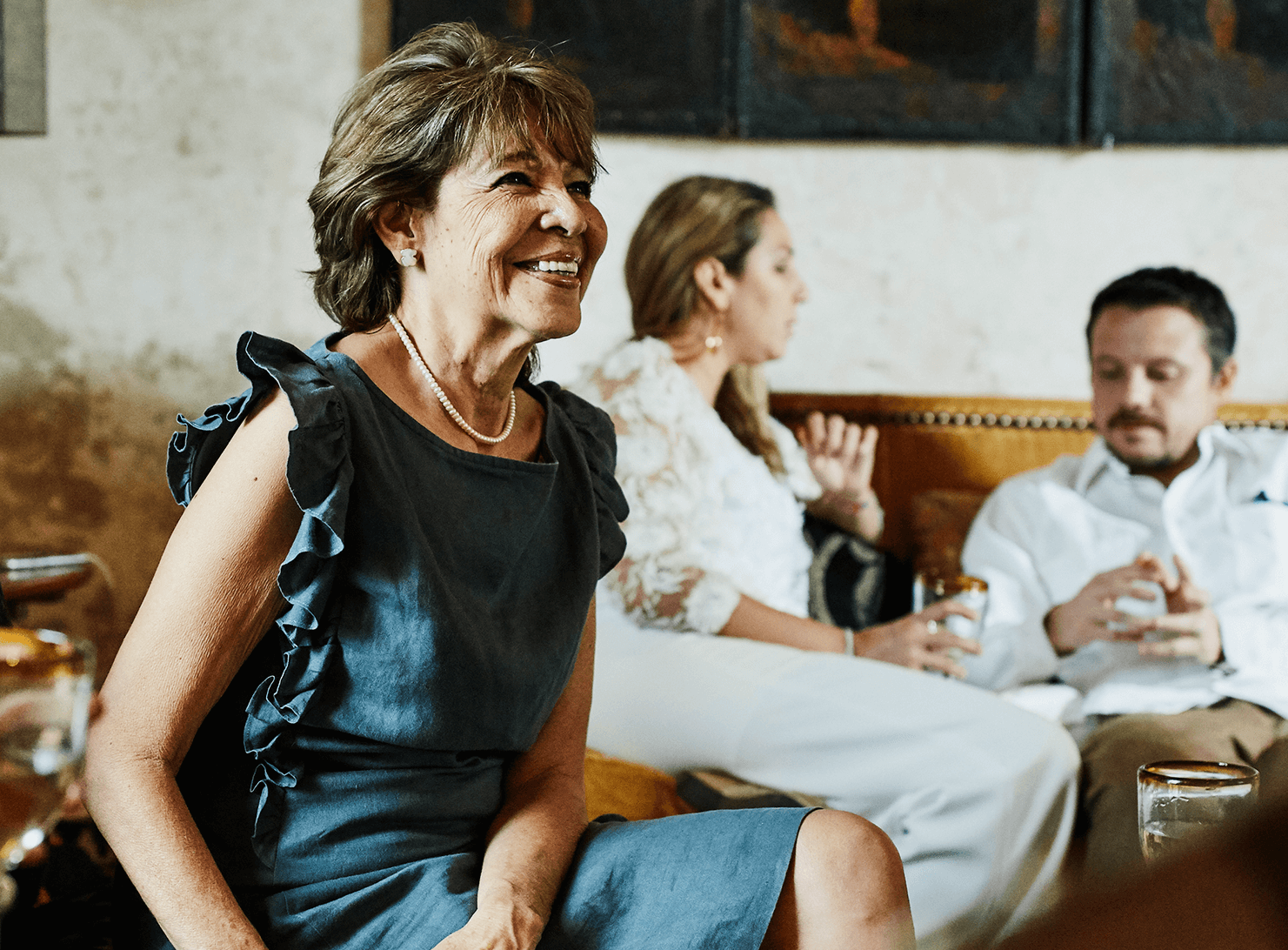 multi-generational men and women socializing