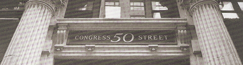 older newspaper quality b&w cropped image of  building with CONGRESS 50 STREET on building