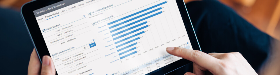 closely cropped image, hands holding tablet showing clientworks report