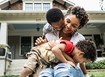 Young African American mother with children outside image