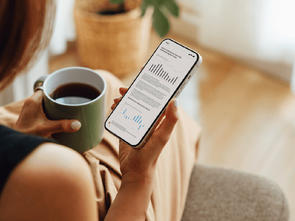 Investor looking at financial market information on her phone.