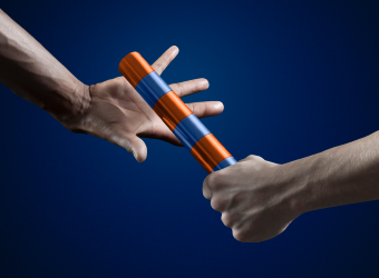 hands passing a baton