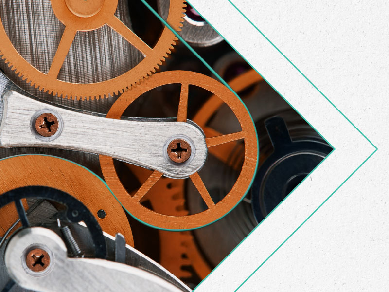 orange, silver, black cogs and gears in tilted white box on white background outlook 2026 press release