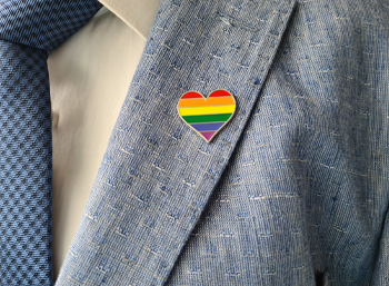 rainbow pin on lapel