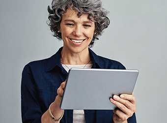 Older Caucasian woman holding tablet image