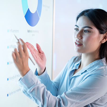 young business woman explaining content from a chart with a circle graph